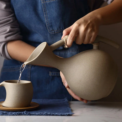 Premium ceramic cold brew teapot set with elegant floral design, including teapot, lid, and bamboo tray