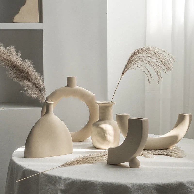 Rustic ceramic vase with matte textured finish for displaying dried flower arrangements in a Scandinavian-inspired home decor setting