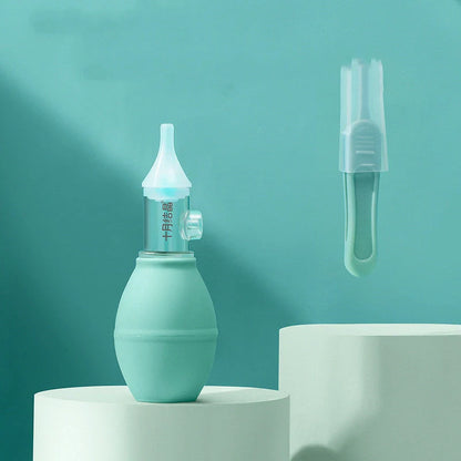 Infant silicone nasal aspirator pump in pink and green, designed for gentle cold relief