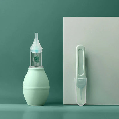 Infant silicone nasal aspirator pump in pink and green, designed for gentle cold relief