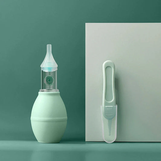 Infant silicone nasal aspirator pump in pink and green, designed for gentle cold relief