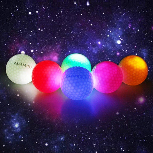 Luminous golf balls emitting a trail of light as they soar through the night sky, offering a captivating golfing experience.