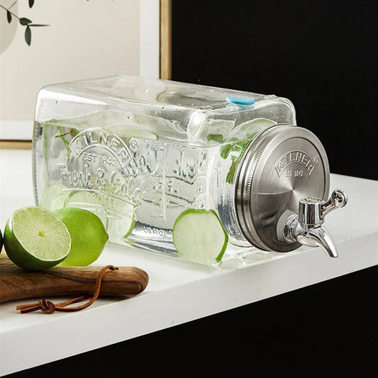 A stylish glass beverage dispenser with a sleek faucet, perfect for serving chilled drinks at home or events.
