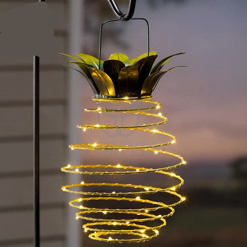 Elegant solar-powered garden lights with a whimsical pineapple design, automatically lighting up from dusk till dawn