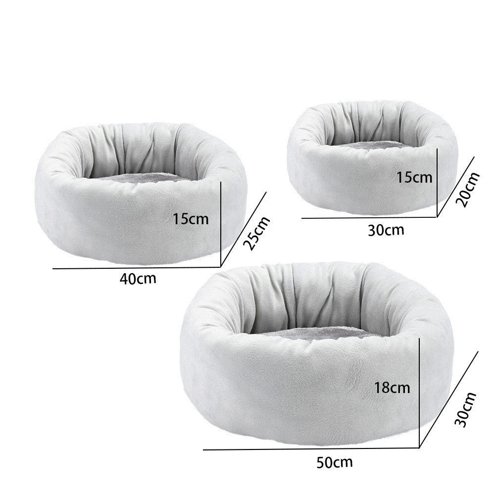 Cosy luxury indoor pet bed for cats and dogs, featuring soft vegan faux shag fur and deep crevices for burrowing comfort