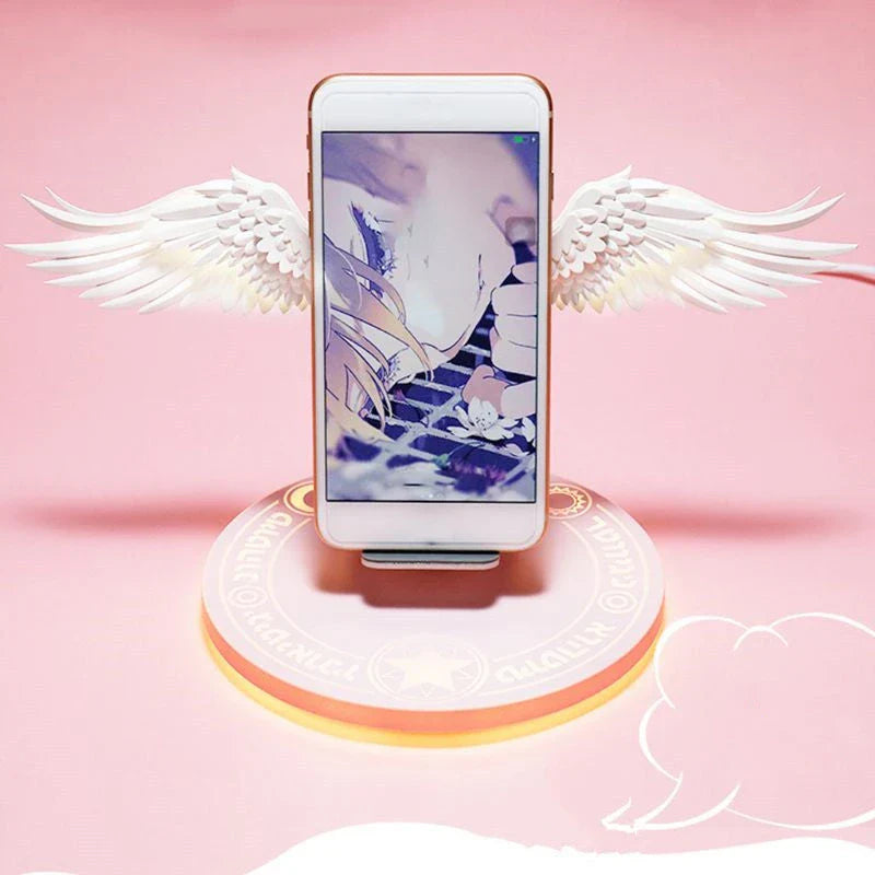 Stylish wireless charging dock with unfolding angel wings, providing fast and safe charging for compatible smartphones