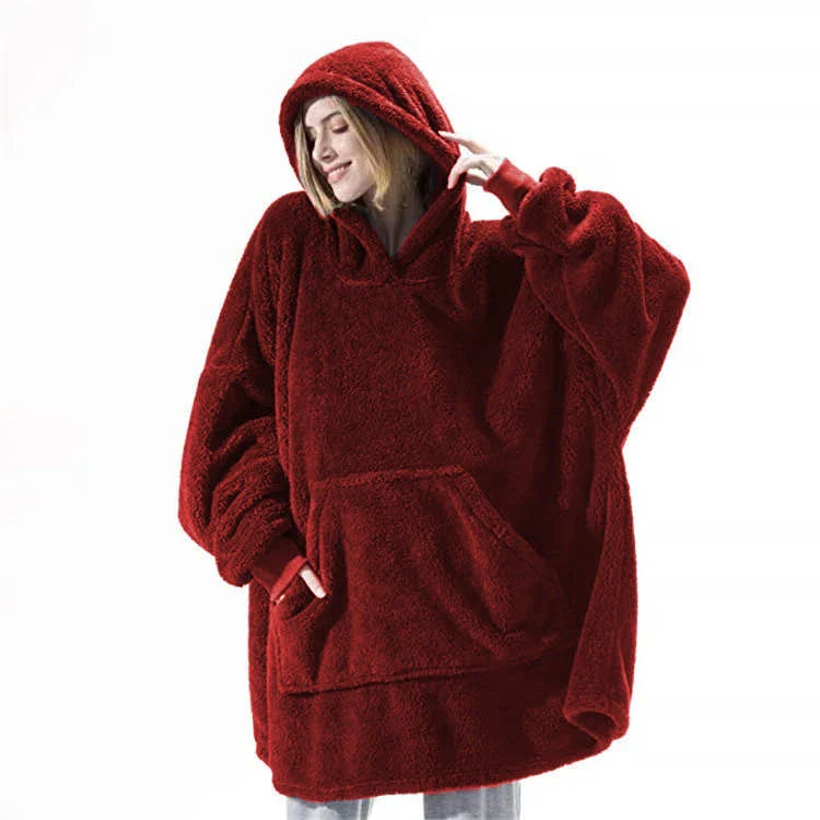Cozy oversized hooded sweatshirt with big front pocket, made of soft double-sided fleece fabric in a variety of classic colors.