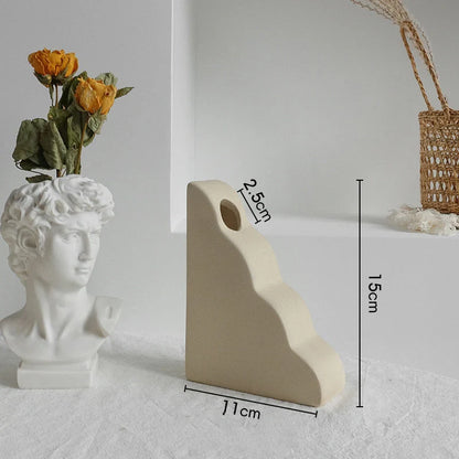 Rustic ceramic vase with matte textured finish for displaying dried flower arrangements in a Scandinavian-inspired home decor setting