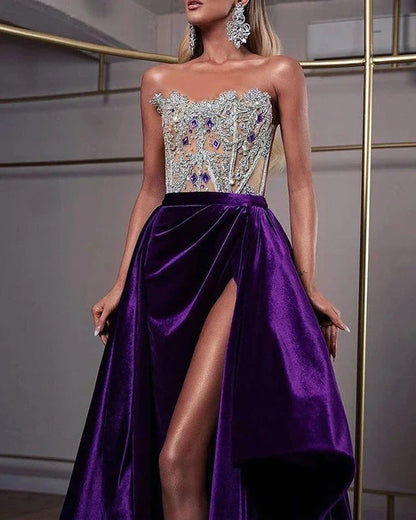 A glamorous purple sequin cocktail dress with a small train, sleeveless design, and rhinestone embellishments, suitable for special occasions in the UK.