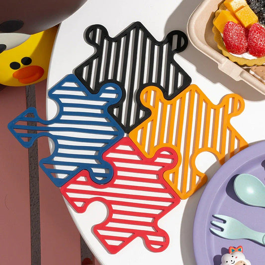 Creative Household Splicing Jigsaw Insulation Pad in blue, black, red, and yellow