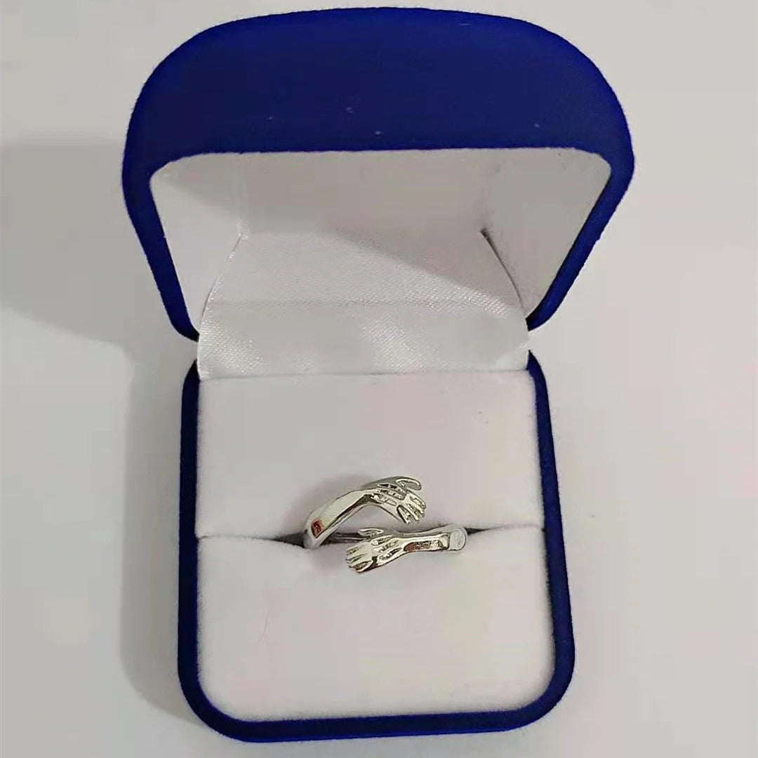 Elegant Adjustable Love Hands Embracing Ring in gold and silver, a perfect symbol of affection
