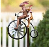 Charming wrought iron garden ornament with whimsical animal motif, adjustable retractable pole, and weather-resistant construction