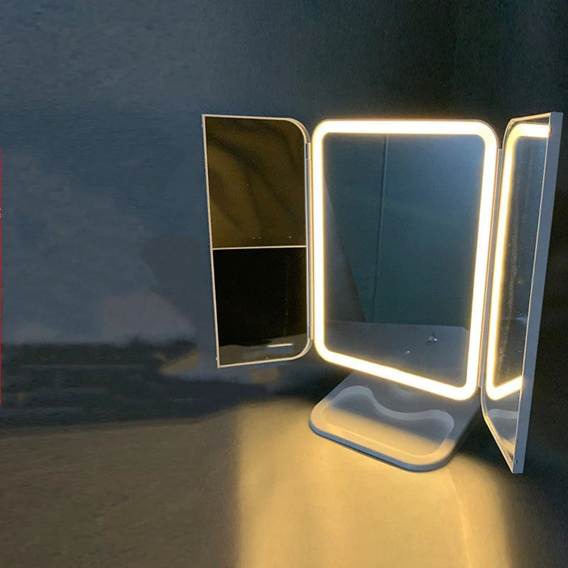 Trifold makeup mirror with LED lighting and 10X magnification