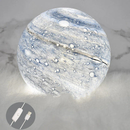 A mesmerising USB-powered night light featuring a captivating wandering earth design and adjustable lighting settings