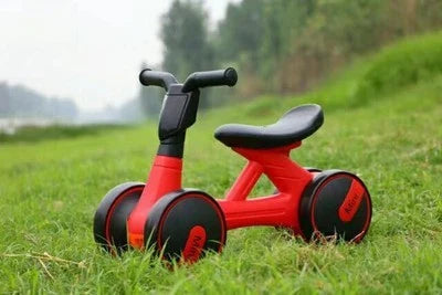 Sturdy three-wheeled balance bike for British toddlers with durable steel frame, comfortable PU leather seat, and smooth-rolling EVA foam tyres