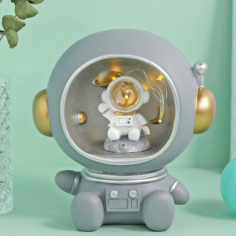Astronaut-themed LED night light piggy bank with hand-painted details
