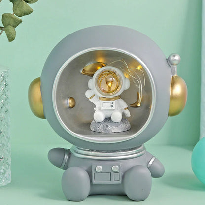 Astronaut-themed LED night light piggy bank with hand-painted details
