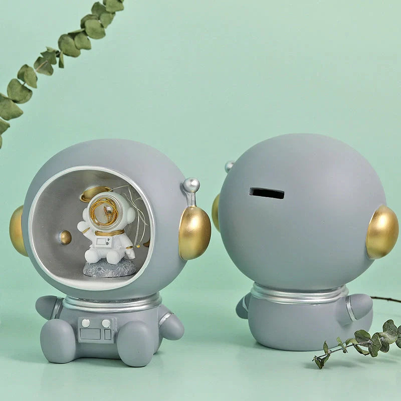 Astronaut-themed LED night light piggy bank with hand-painted details