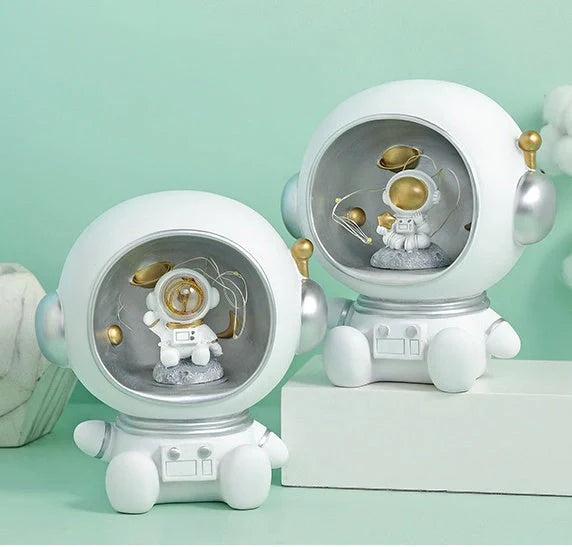 Astronaut-themed LED night light piggy bank with hand-painted details