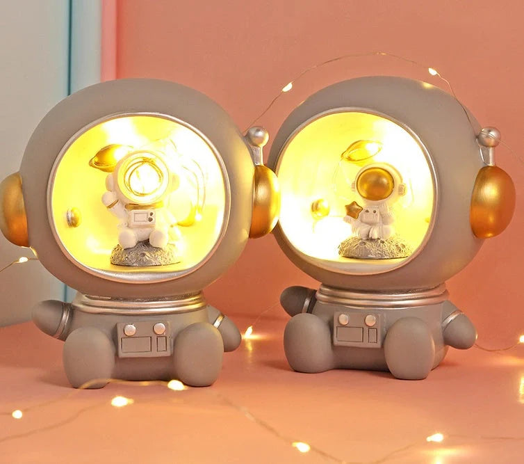 Astronaut-themed LED night light piggy bank with hand-painted details