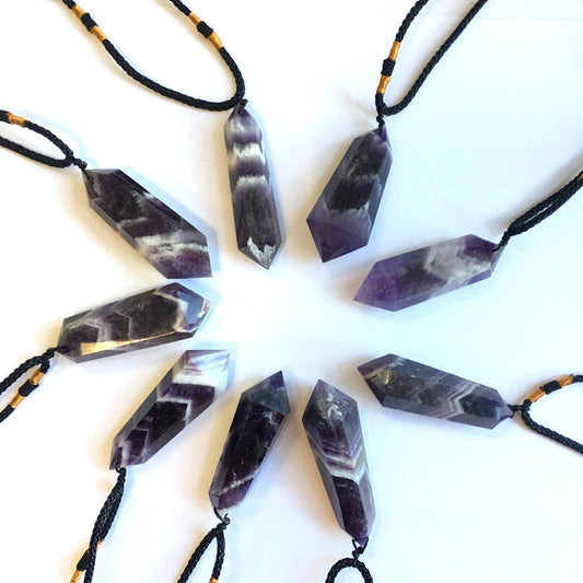 A natural amethyst double-pointed crystal pendant with unique iridescent lines and captivating hues, handcrafted from genuine fluorite quartz.