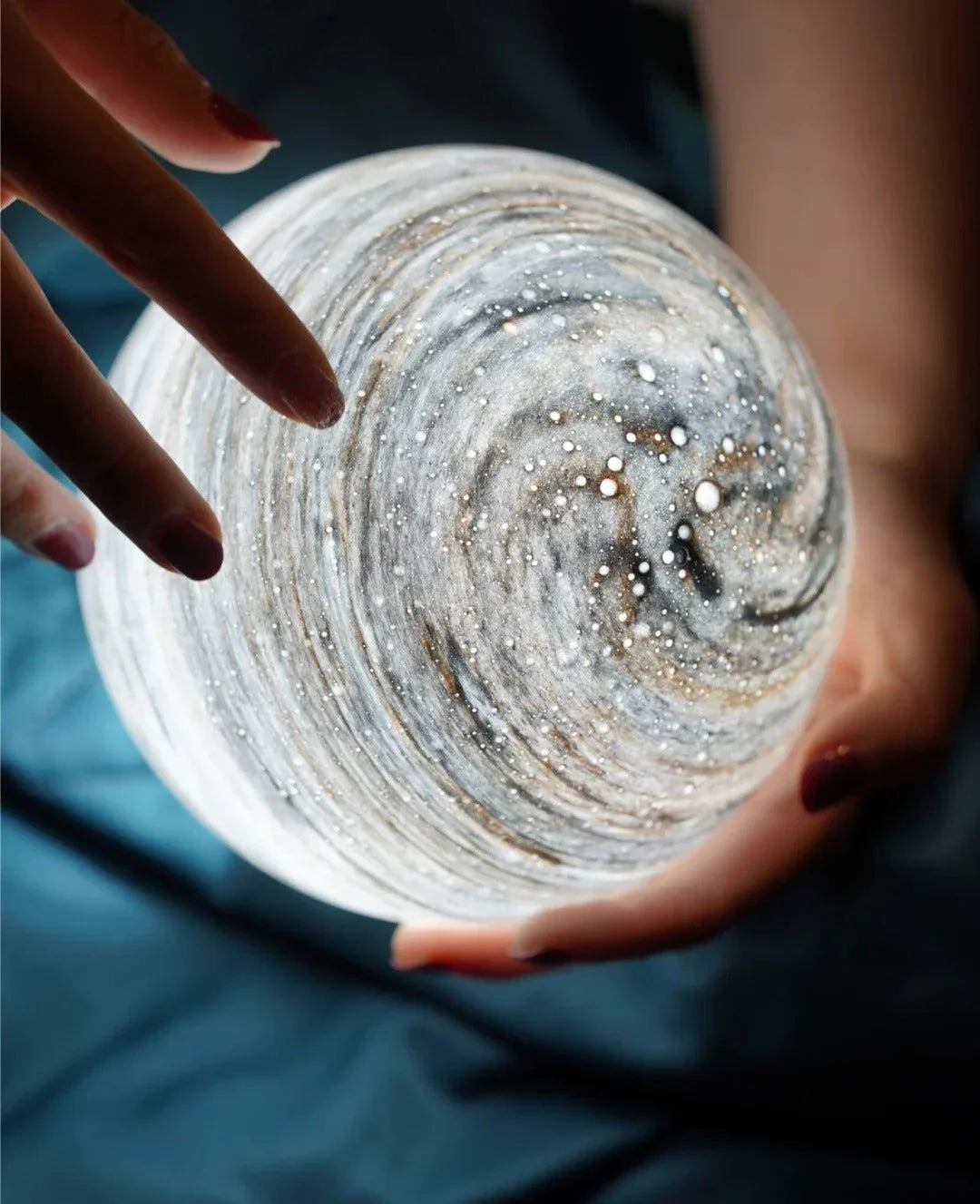 A mesmerising USB-powered night light featuring a captivating wandering earth design and adjustable lighting settings