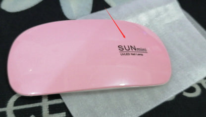 Compact and portable USB-powered nail light therapy machine with adjustable angle and LED light for at-home nail care