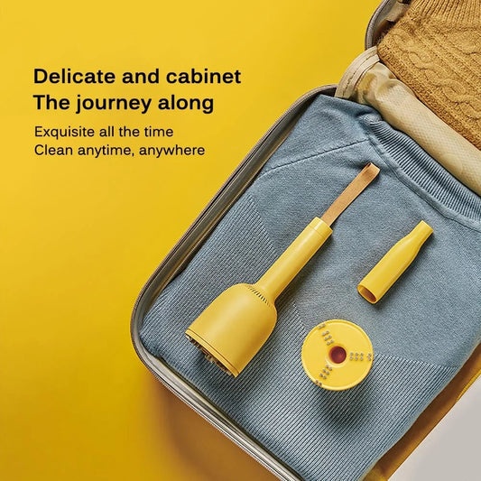 Portable rechargeable vacuum cleaner with hairball trimmer and USB charging