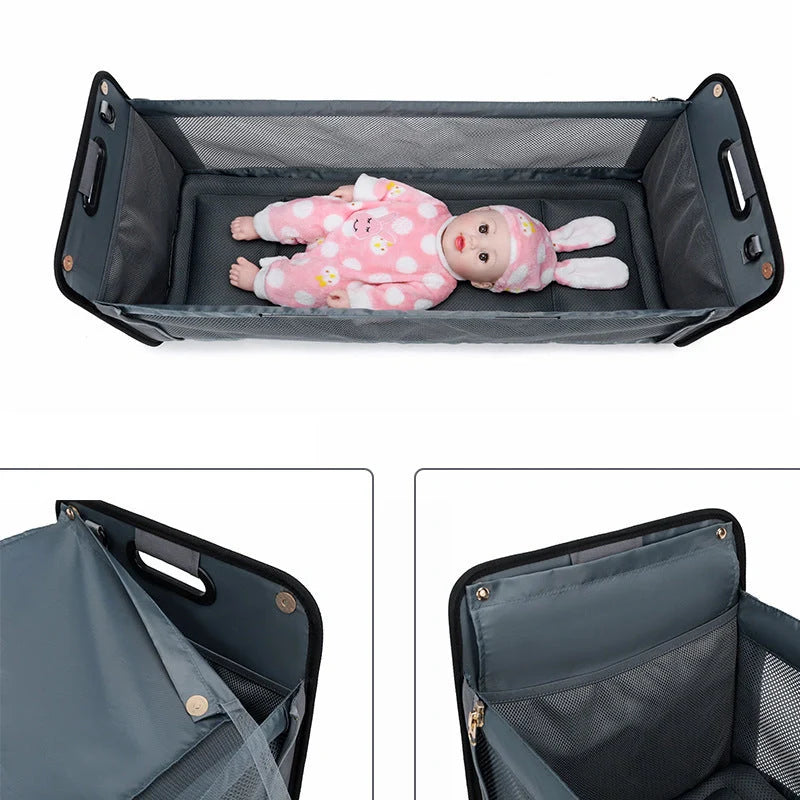 Portable shoulder folding bed baby nappy messenger bag in green, orange, black, and light grey