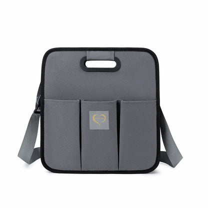 Portable shoulder folding bed baby nappy messenger bag in green, orange, black, and light grey