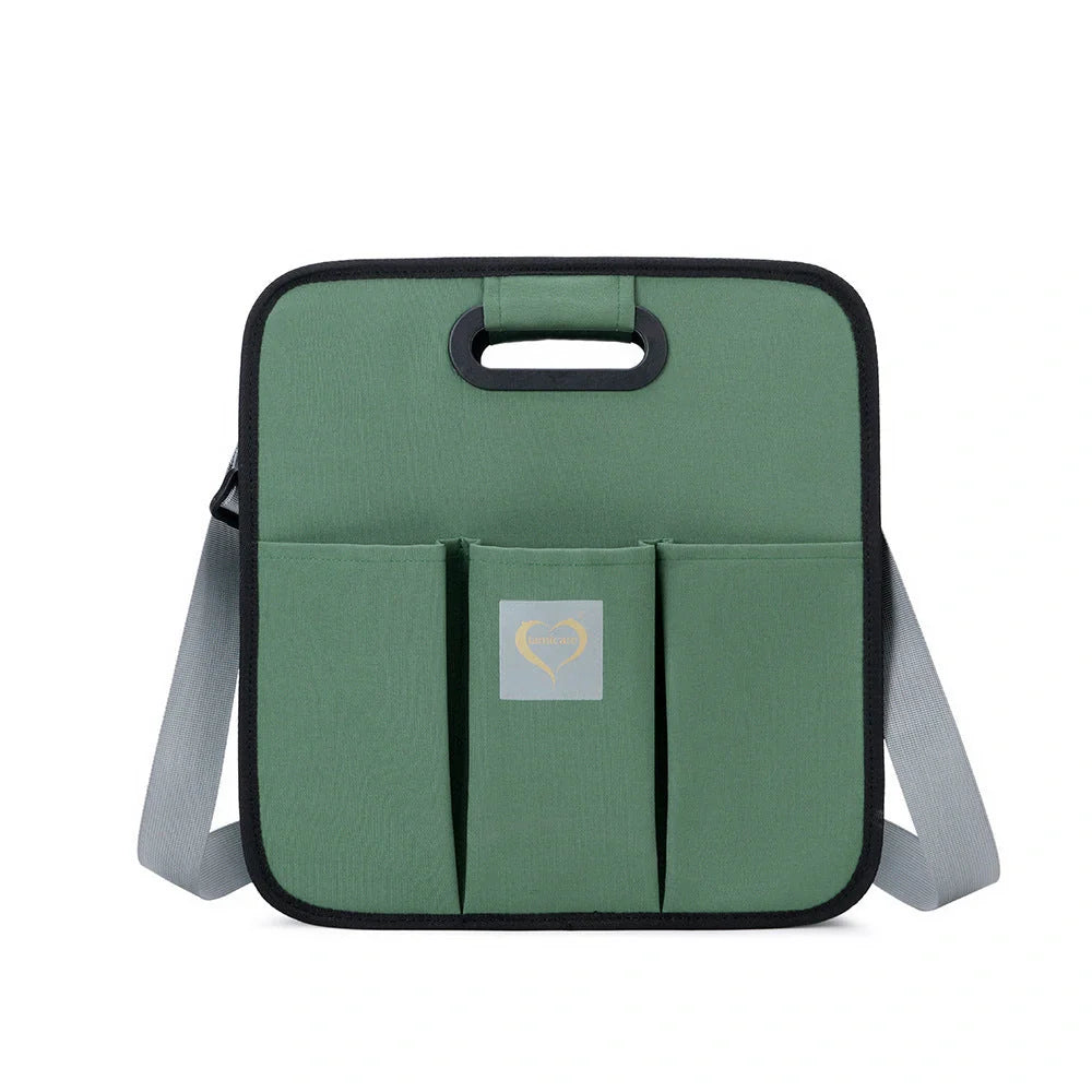 Portable shoulder folding bed baby nappy messenger bag in green, orange, black, and light grey