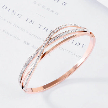 Titanium steel bracelet with geometric diamond detailing, available in rose gold, golden, and silver finishes
