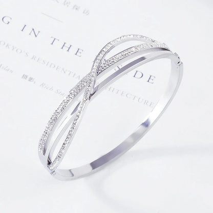 Titanium steel bracelet with geometric diamond detailing, available in rose gold, golden, and silver finishes