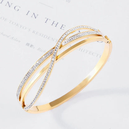 Titanium steel bracelet with geometric diamond detailing, available in rose gold, golden, and silver finishes