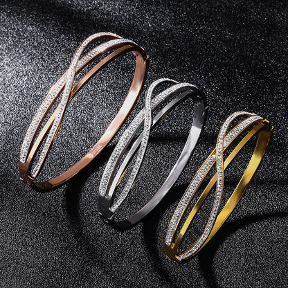 Titanium steel bracelet with geometric diamond detailing, available in rose gold, golden, and silver finishes