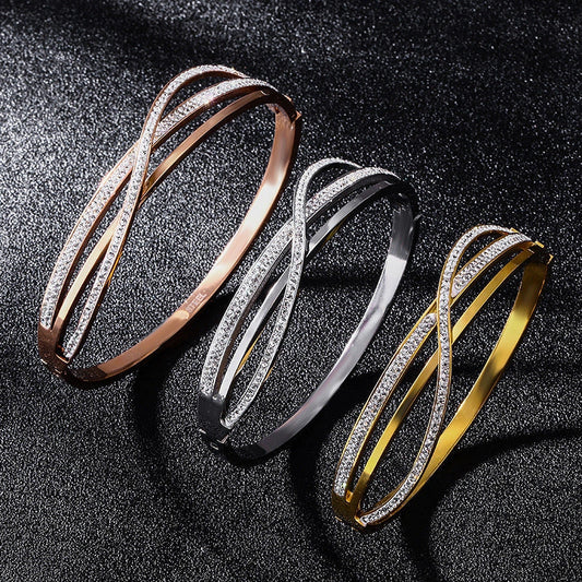 Titanium steel bracelet with geometric diamond detailing, available in rose gold, golden, and silver finishes