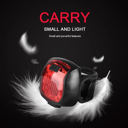 Rechargeable bicycle tail light with 5 adjustable lighting modes, made of durable ABS plastic for scratch and impact resistance.