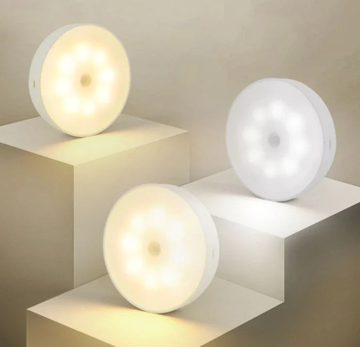 Motion-activated LED puck lights in warm and white color options, with various pack sizes and USB recharging