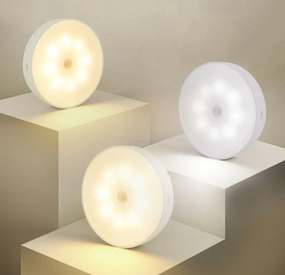 Motion-activated LED puck lights in warm and white color options, with various pack sizes and USB recharging