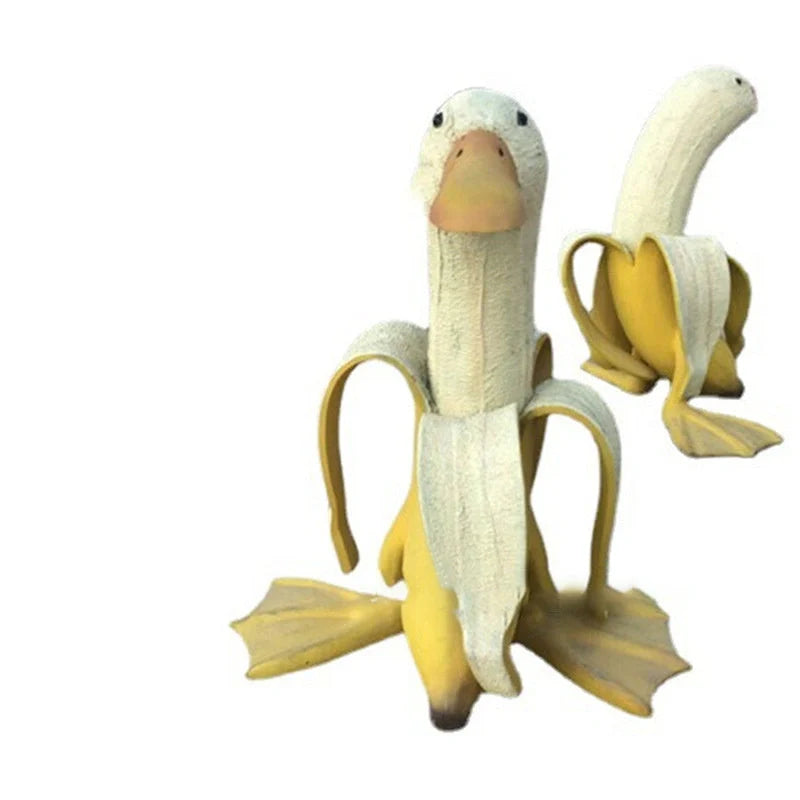 Banana Duck Resin Garden Ornament with vibrant yellow colour and cartoon design