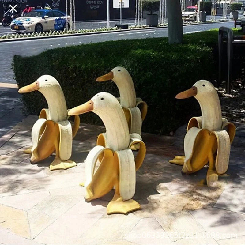 Banana Duck Resin Garden Ornament with vibrant yellow colour and cartoon design