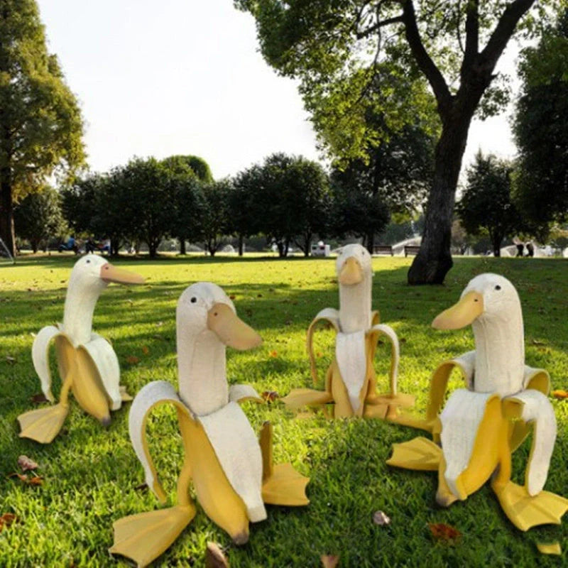Banana Duck Resin Garden Ornament with vibrant yellow colour and cartoon design