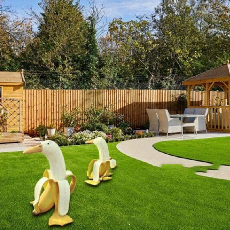 Banana Duck Resin Garden Ornament with vibrant yellow colour and cartoon design