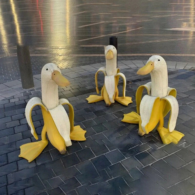 Banana Duck Resin Garden Ornament with vibrant yellow colour and cartoon design