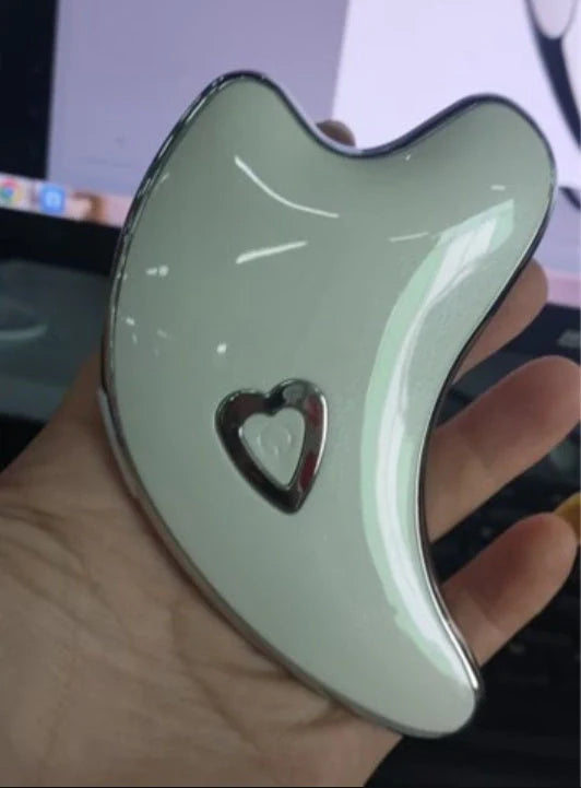 Electric Gua Sha Facial Massager with LED light and microcurrent technology for skin rejuvenation