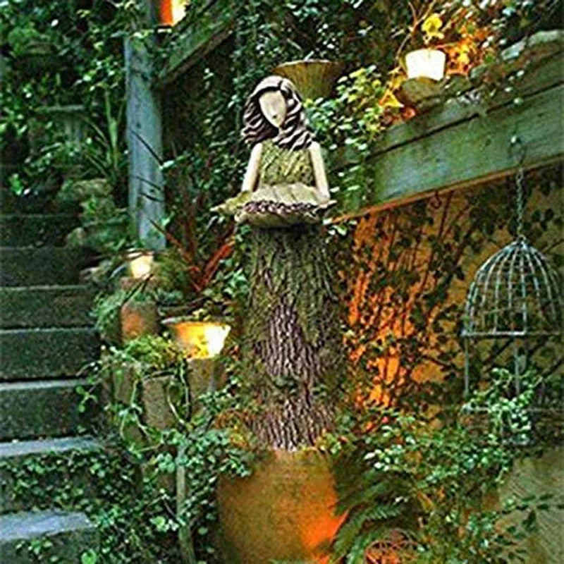 Sherwood Fern Fairy Statuary Resin Bird Feeder with leaf-shaped holder in garden setting