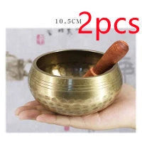 A handcrafted Tibetan singing bowl made of copper, used for meditation and relaxation.