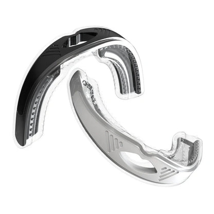 Anti-snoring device braces in white and black, made from food-grade silicone