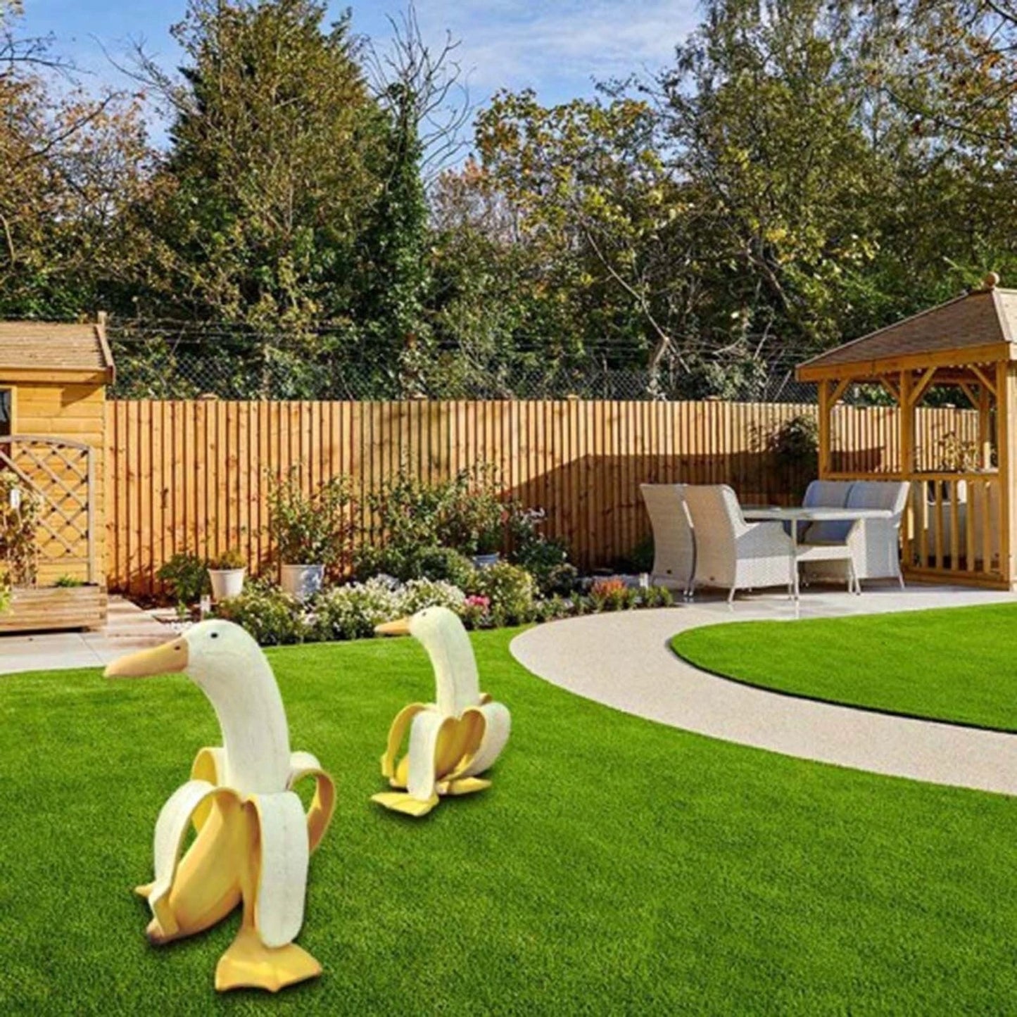 Banana Duck Resin Garden Ornament with vibrant yellow colour and cartoon design