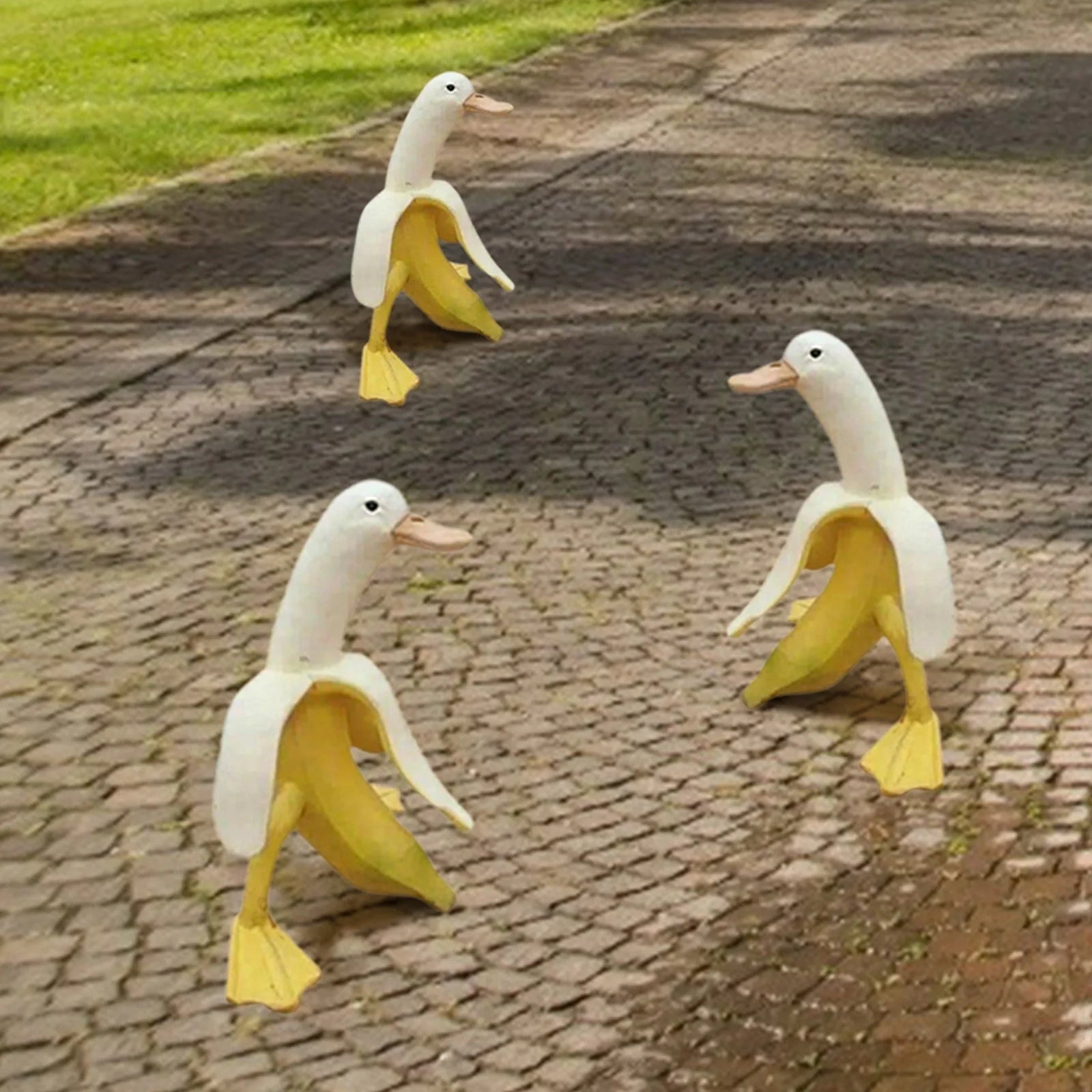 Banana Duck Resin Garden Ornament with vibrant yellow colour and cartoon design